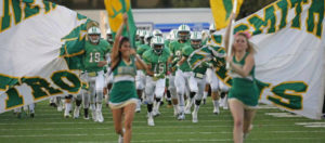 cheerleaders football players running